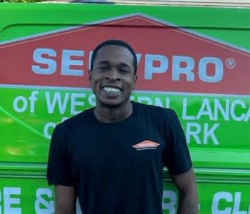 Nate Greennagh in front of SERVPRO van